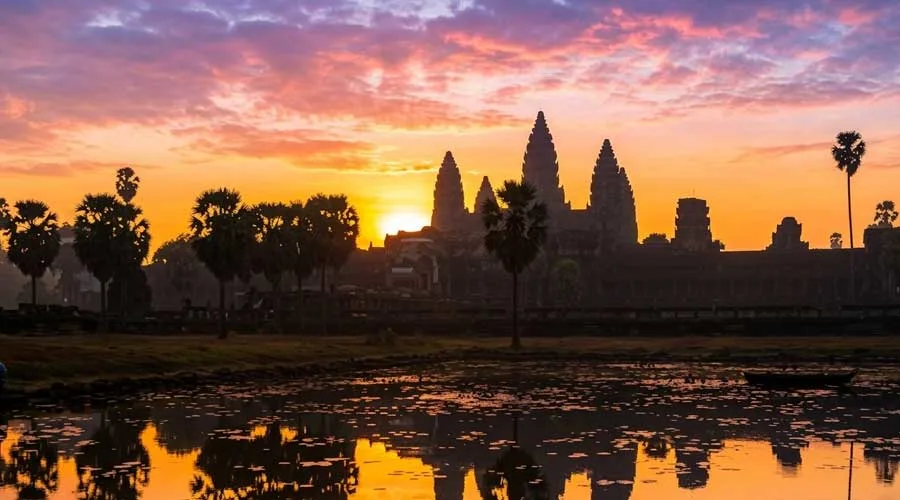 Angkor Wat sunrise silhouette reflection on water Siem Reap Cambodia